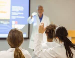 Medical students sitting in a classroom listening to a lecture